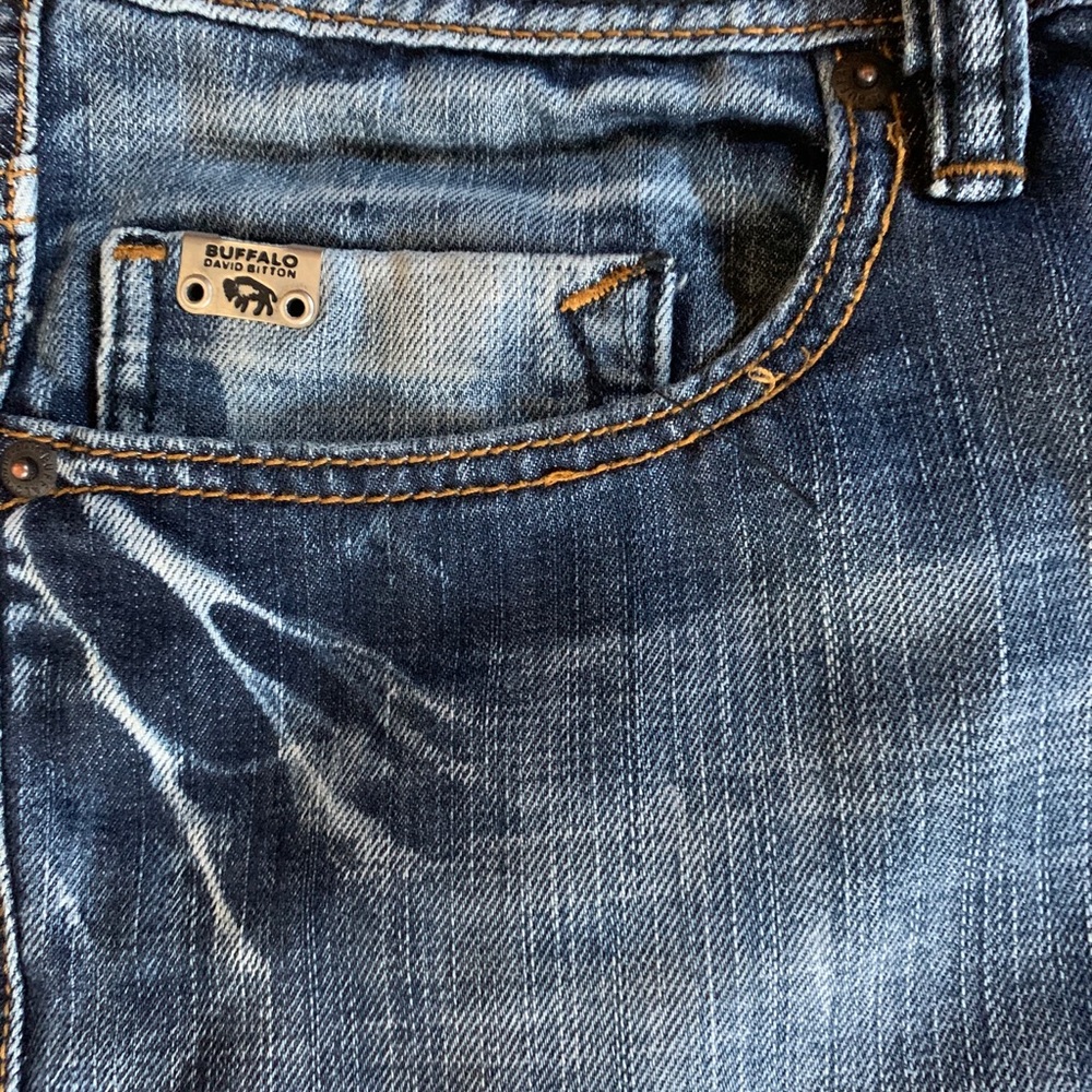 2 pairs jeans and 1 pair of kuhl men’s shorts.
